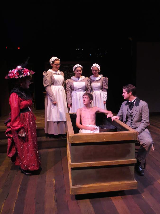 Mrs. Kendal, played by Maddie Sell, visits the London hospital where the Elephant Man John Merrick, played by Nick Saxton, was taken by Dr. Treves, played by Jackson Cobb. The nurses stand by to help, played by McKenna Barker, Sydney Zatz, and Lizzie Sandstrom. 