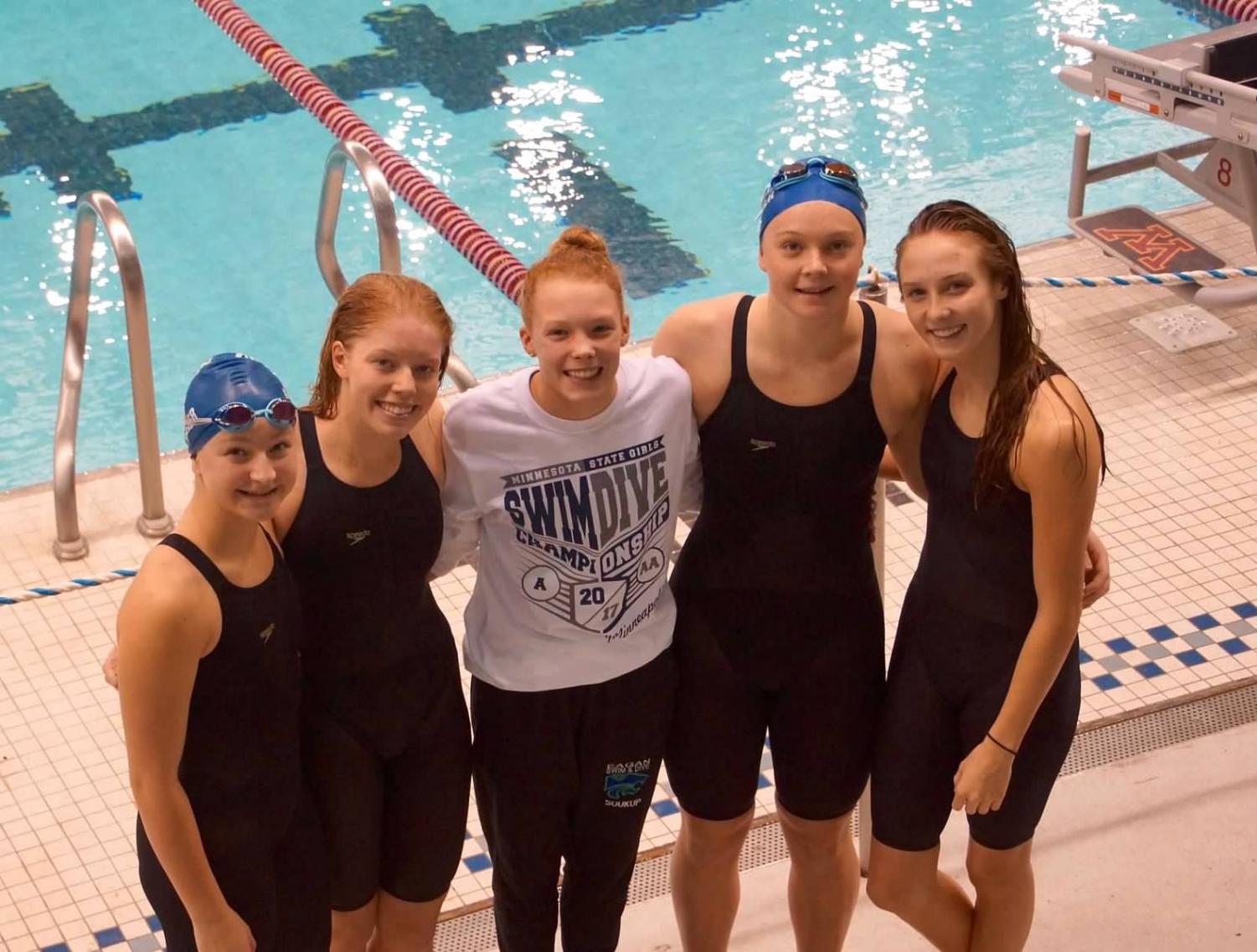 Fischer, Lenertz, Soukup, Joerger and Mitchell pose for a photo on deck