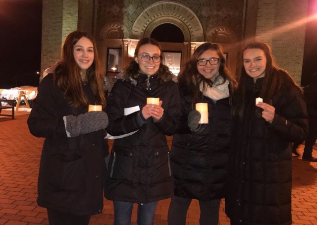 Walkout organizers Annika Scott, Emma Anderson, Lizzy Sabel, and Macy Harder pose for a picture at the vigil. Image courtesy of Emma Anderson. 