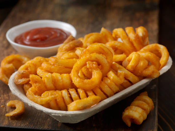 Spicy+Curly+Fries+with+Ketchup+in+a+Take+out+Container